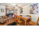 Cozy dining area with wooden table and view into living room at 7310 Oakshire Dr, Port Richey, FL 34668