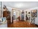 Living room with hardwood floors and built in shelving at 7310 Oakshire Dr, Port Richey, FL 34668