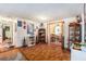 Bright living room with hardwood floors and a view into the dining area at 7310 Oakshire Dr, Port Richey, FL 34668