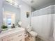 Clean bathroom featuring a shower/tub combo and updated vanity at 818 W Adalee St, Tampa, FL 33603