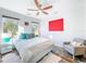 Bright bedroom with cozy seating and large windows at 818 W Adalee St, Tampa, FL 33603