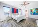 Bright bedroom with a king-size bed, hardwood floors, and large windows at 818 W Adalee St, Tampa, FL 33603