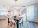 Modern dining room features a dark wood table with white chairs and a statement light fixture at 818 W Adalee St, Tampa, FL 33603