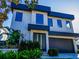 Modern two-story home with dark-blue accents and landscaping at 818 W Adalee St, Tampa, FL 33603