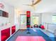 Modern home gym with built-in storage and TV at 818 W Adalee St, Tampa, FL 33603