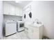 Clean laundry room with washer, dryer, and sink at 818 W Adalee St, Tampa, FL 33603