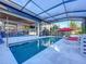 Resort-style pool with covered patio and outdoor seating at 818 W Adalee St, Tampa, FL 33603