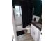 Clean bathroom with tub, shower, white vanity and gray countertop at 895 64Th S Ave, St Petersburg, FL 33705