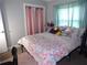 Bedroom with double bed, and pink and floral bedding at 895 64Th S Ave, St Petersburg, FL 33705