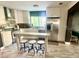 Modern kitchen with stainless steel appliances and island at 895 64Th S Ave, St Petersburg, FL 33705