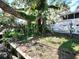 Charming backyard with a rope swing and lush landscaping at 9934 Peninsular Dr, Gibsonton, FL 33534