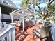 Enjoy this relaxing deck with pergola and comfortable wicker furniture at 9934 Peninsular Dr, Gibsonton, FL 33534