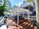 Spacious deck with pergola, comfy seating, creating an inviting outdoor space at 9934 Peninsular Dr, Gibsonton, FL 33534