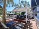 Large deck with pergola and lounge chairs, perfect for outdoor entertaining at 9934 Peninsular Dr, Gibsonton, FL 33534