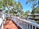 Relaxing waterfront deck with pergola, seating area, and stunning water views at 9934 Peninsular Dr, Gibsonton, FL 33534