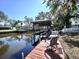 Private dock with covered seating, ideal for fishing or relaxing by the water at 9934 Peninsular Dr, Gibsonton, FL 33534