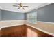 Bright bedroom with hardwood floors and neutral walls at 10112 Haverhill Ridge Dr, Riverview, FL 33578