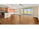 Dining room with hardwood floors, orange accent wall, and view to patio at 10112 Haverhill Ridge Dr, Riverview, FL 33578