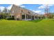 Exterior view of the property showing the backyard and lake at 10112 Haverhill Ridge Dr, Riverview, FL 33578