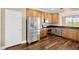 Modern kitchen with stainless steel appliances and wood cabinets at 10112 Haverhill Ridge Dr, Riverview, FL 33578