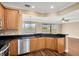 Kitchen with wood cabinets, granite counters, and stainless steel appliances at 10112 Haverhill Ridge Dr, Riverview, FL 33578