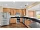 Modern kitchen with stainless steel appliances and wood cabinets at 10112 Haverhill Ridge Dr, Riverview, FL 33578