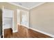 Hardwood floor office with access to hallway and storage at 10112 Haverhill Ridge Dr, Riverview, FL 33578