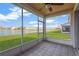 Enjoy the view from this screened porch overlooking a peaceful lake at 10112 Haverhill Ridge Dr, Riverview, FL 33578