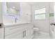 Modern bathroom with white cabinets and marble countertops at 10971 90Th Ave, Seminole, FL 33772