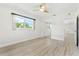 Spacious bedroom with light wood flooring and large windows at 10971 90Th Ave, Seminole, FL 33772