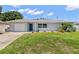 Newly renovated single story home with a modern facade and landscaped lawn at 10971 90Th Ave, Seminole, FL 33772