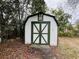 White shed with green doors at 12266 Folger St, Spring Hill, FL 34609