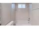 Small bathroom with shower/tub combo and neutral tile at 12311 Silton Peace Dr, Riverview, FL 33579