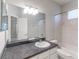 Clean bathroom with a single sink vanity, shower/tub combo, and tile flooring at 12311 Silton Peace Dr, Riverview, FL 33579