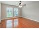 Large bedroom with hardwood floors and neutral color palette at 12311 Silton Peace Dr, Riverview, FL 33579