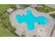 Inviting community pool with surrounding lounge chairs and playground at 12311 Silton Peace Dr, Riverview, FL 33579