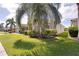 Side view of a one-story house with attractive landscaping and palm trees at 12311 Silton Peace Dr, Riverview, FL 33579