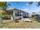 Backyard oasis with lounge chairs and canal view at 12620 3Rd Isle, Hudson, FL 34667