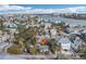 Aerial view of property and surrounding houses near beach at 128 Bay Plz, Treasure Island, FL 33706