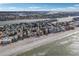 Aerial perspective showcasing beachfront homes and ocean at 128 Bay Plz, Treasure Island, FL 33706