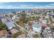 Aerial view of a residential area near the beach, featuring houses and streets at 128 Bay Plz, Treasure Island, FL 33706