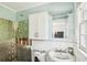 Partially renovated bathroom with exposed walls and a sink at 128 Bay Plz, Treasure Island, FL 33706