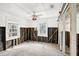 Renovation project: stripped bedroom with exposed walls and flooring at 128 Bay Plz, Treasure Island, FL 33706