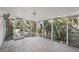 Small screened porch with tile floor, offering a view of the backyard at 128 Bay Plz, Treasure Island, FL 33706