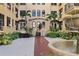 Courtyard with fountain, tropical plants, and building entrance at 130 4Th N Ave # 414, St Petersburg, FL 33701