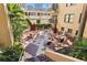 Inviting courtyard with hexagonal tile, seating areas, and lush landscaping at 130 4Th N Ave # 414, St Petersburg, FL 33701
