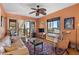 Living room with light walls, ceiling fan, and access to a balcony at 130 4Th N Ave # 414, St Petersburg, FL 33701