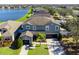 Two story house with lake view and driveway at 13458 Graham Yarden Dr, Riverview, FL 33579
