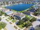 Aerial view of house near lake with community view at 13458 Graham Yarden Dr, Riverview, FL 33579