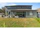 Large backyard with patio and green grass at 13458 Graham Yarden Dr, Riverview, FL 33579